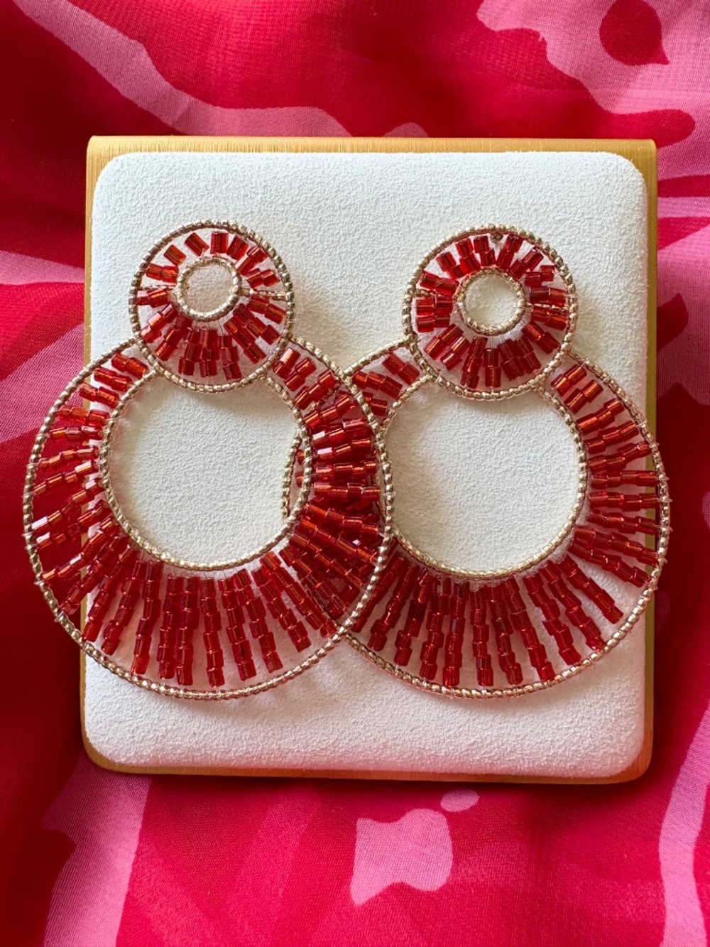 Red Beaded Hoop Earrings in Gold Tone by Plunder Design